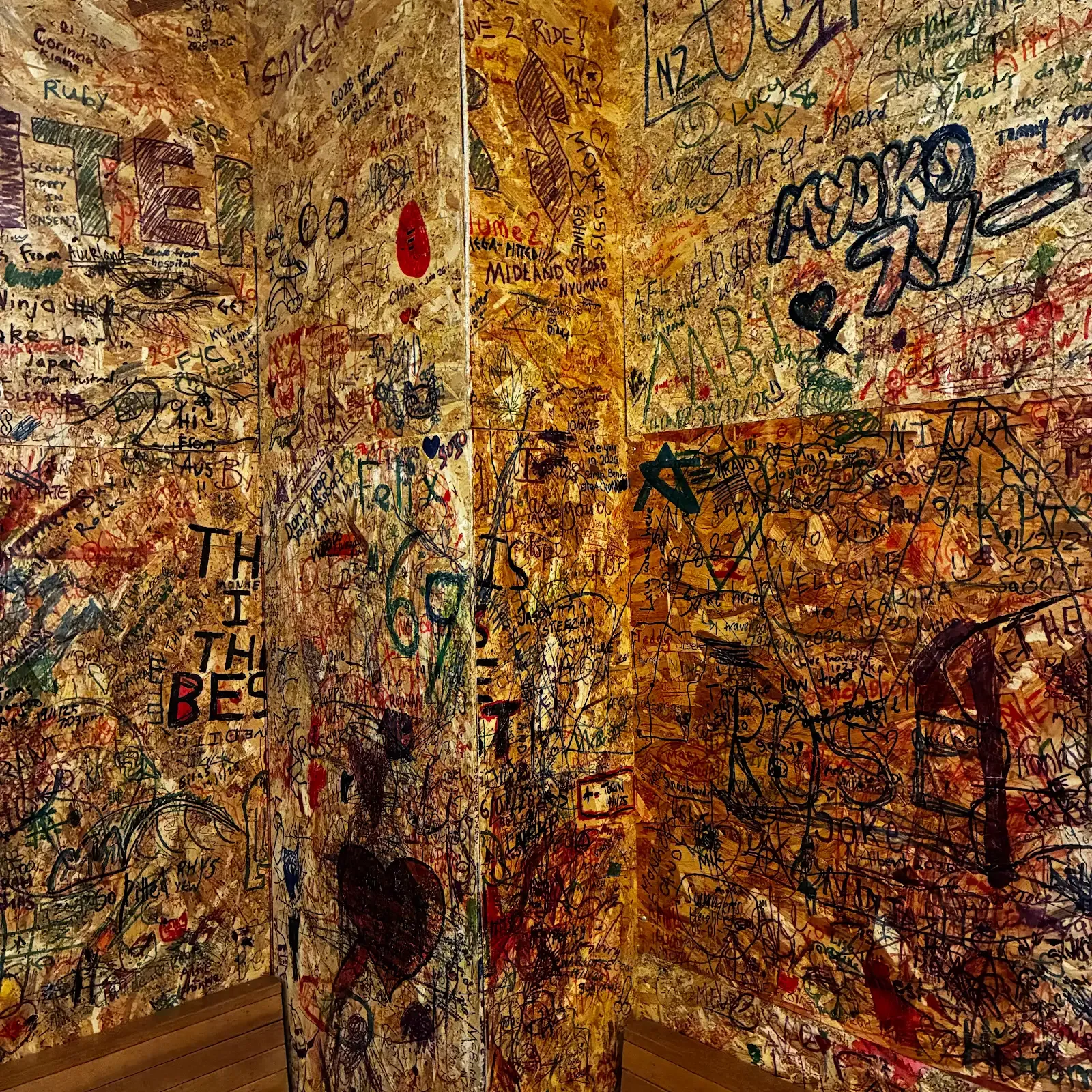 The wall covered in guests' drawings
