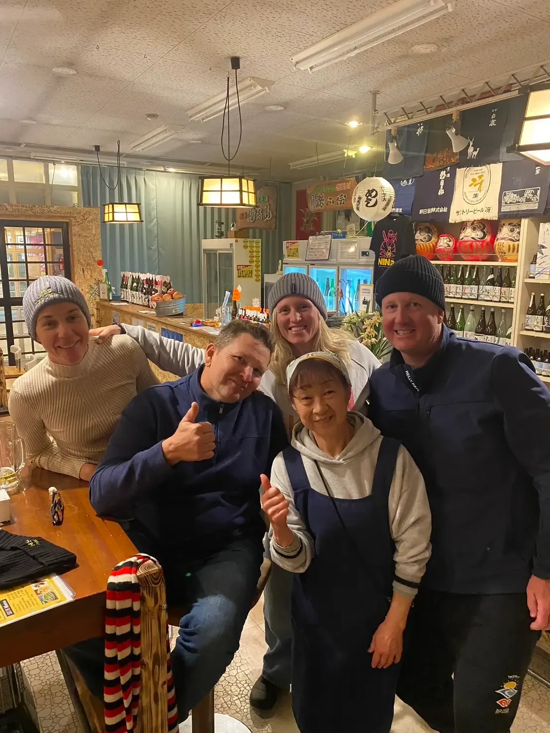 A smiling group gathered inside NINJA