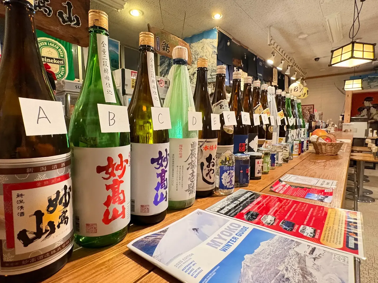 Sake bottles lined up along the NINJA counter